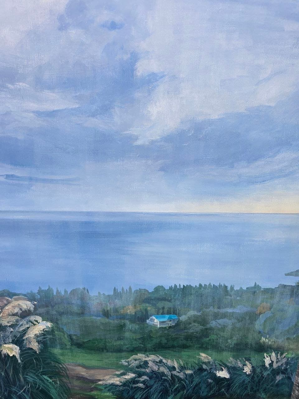 Painting of a rocky sea coast with a villa on the hill